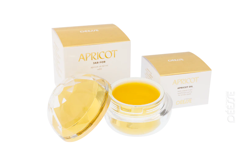 Déesse Aprikosenöl 50 ml im Refill-Einsatz und geöffnete Refill-Kugel mit den zugehörigen Verpackungen